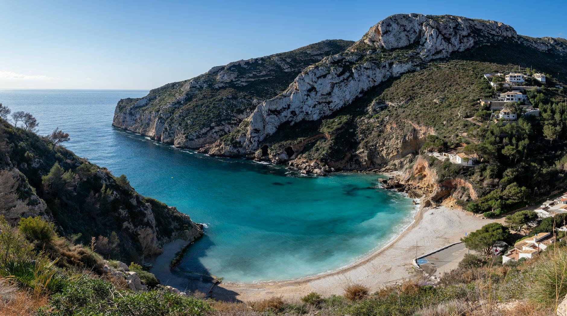 Explore the stunning coastline of Jávea, Spain with this picturesque cove and beach.