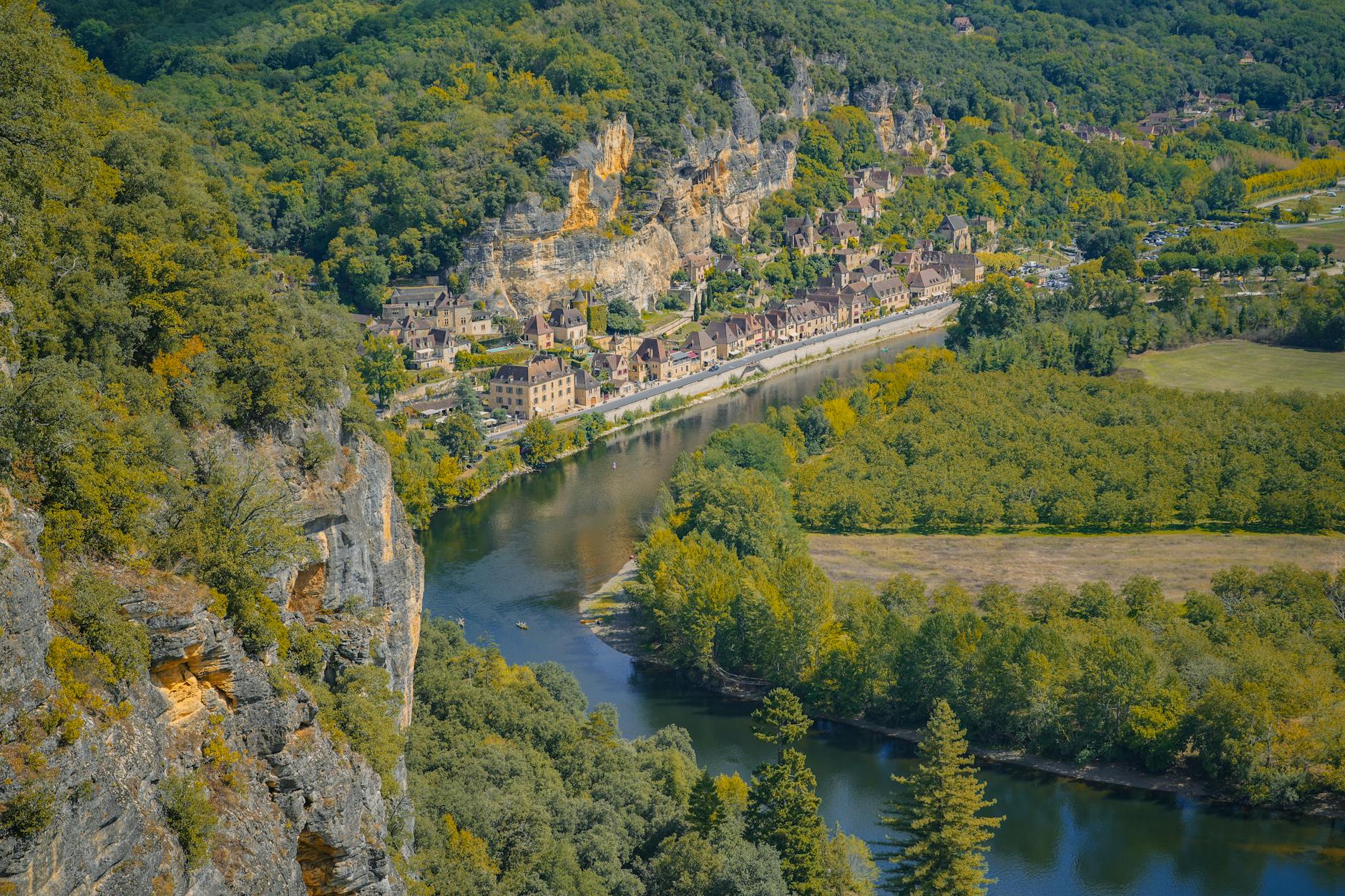 A breathtaking aerial view of the Dordogne Valley showcasing lush greenery and a winding river.