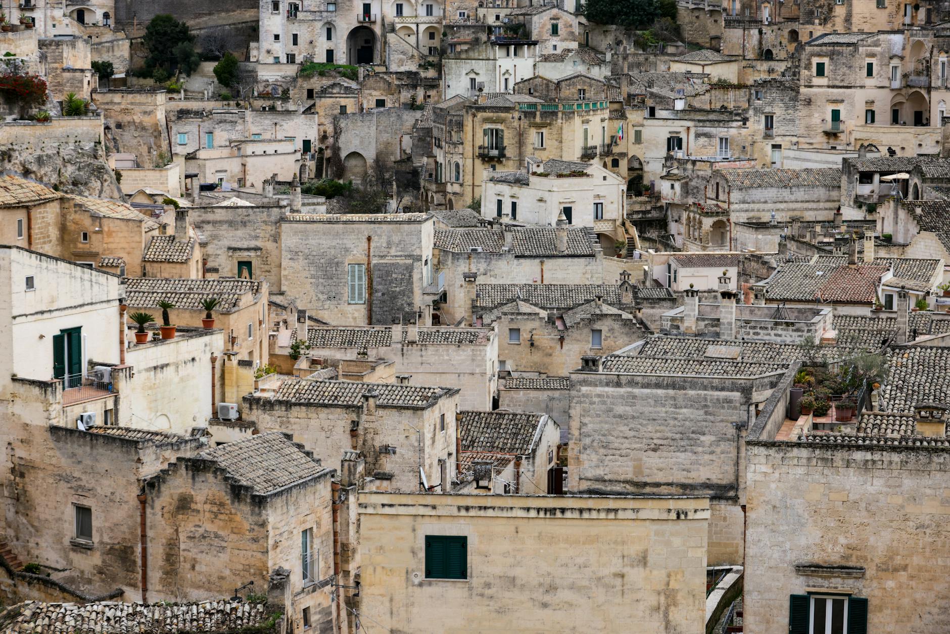 Aerial view of the historic Sassi di Matera showcasing ancient Italian architecture and traditional stone houses.