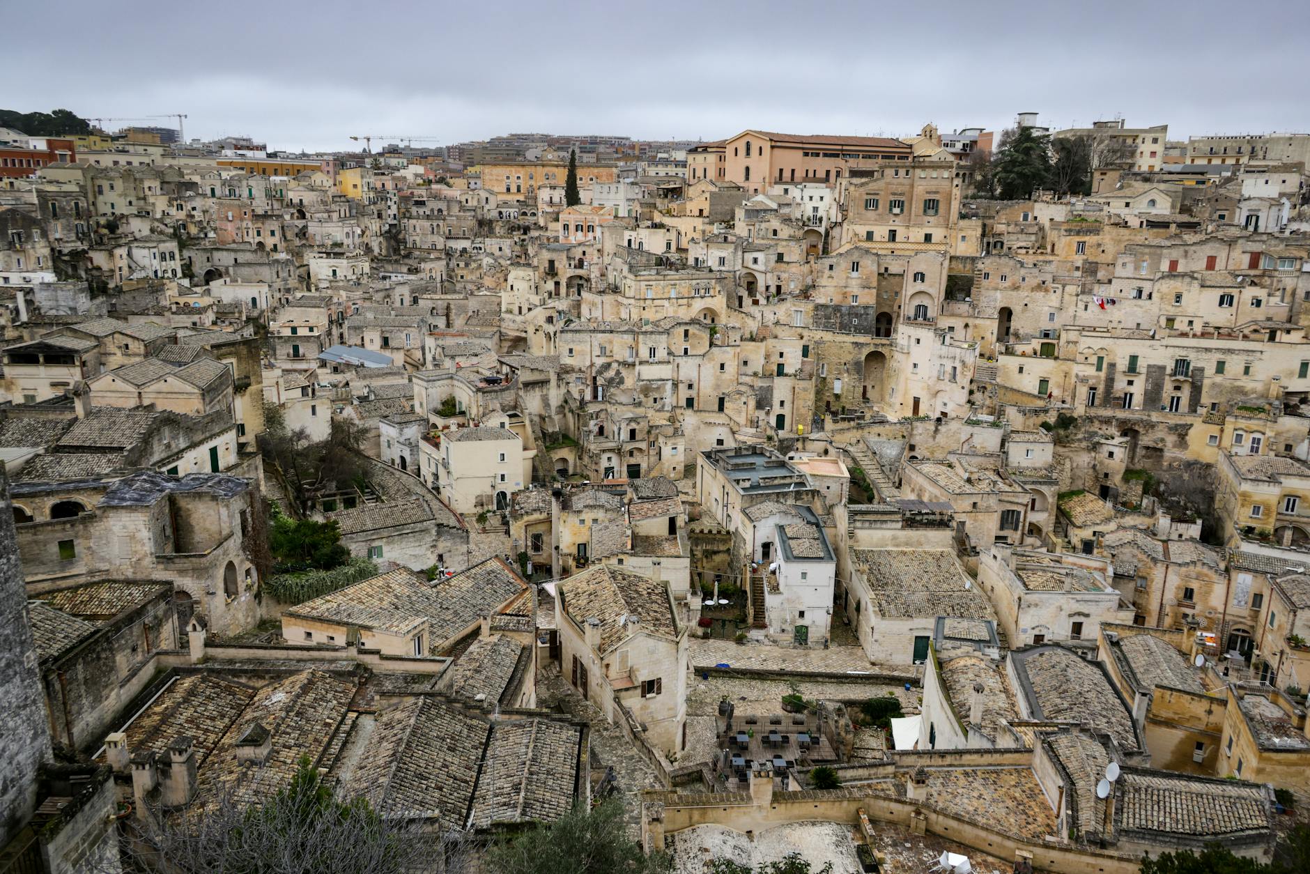 Aerial view of the ancient stone buildings in Matera, showcasing historic Italian architecture.