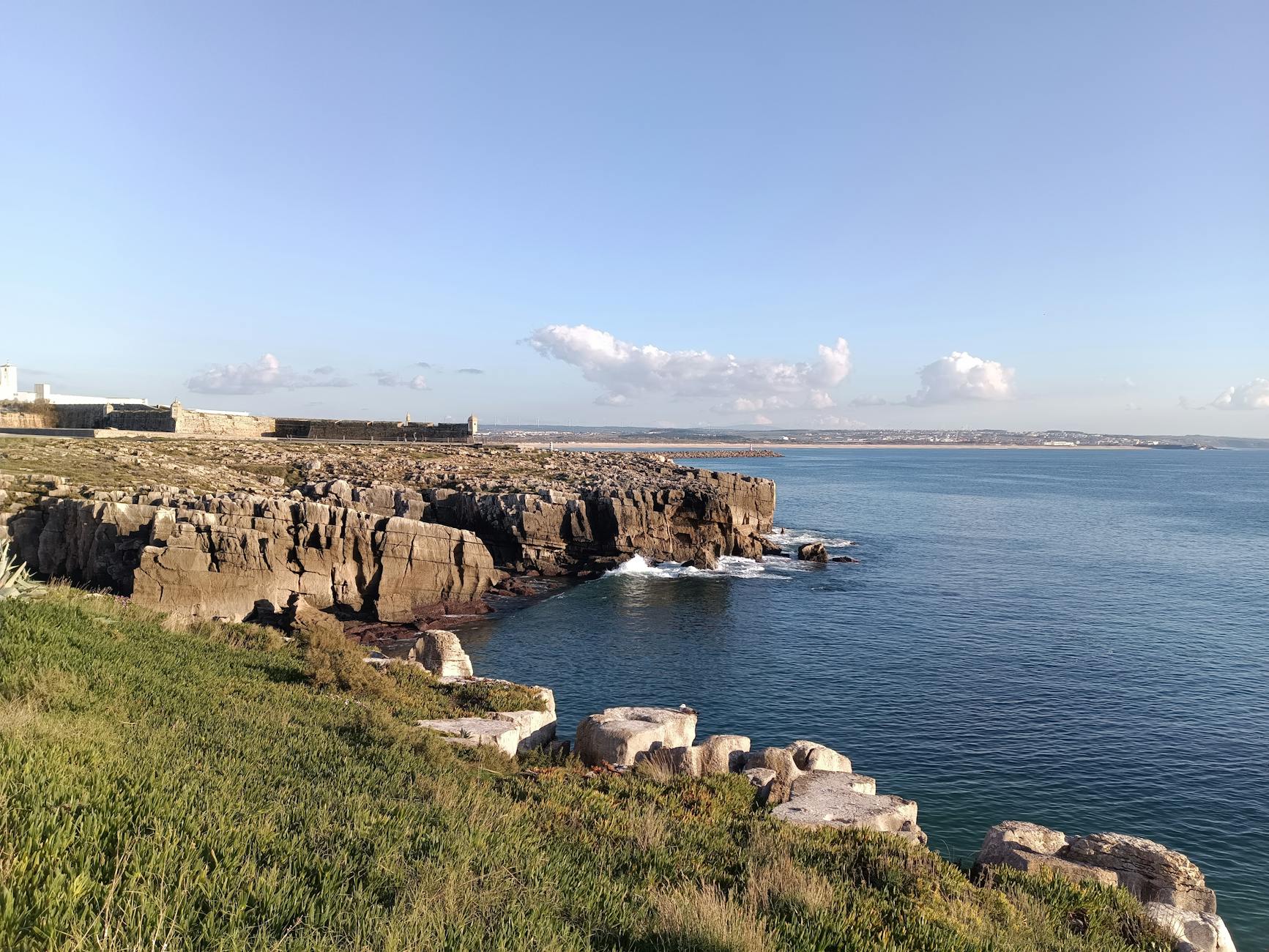Beautiful coastal landscape of Peniche, Portugal with rocky cliffs and blue sea.