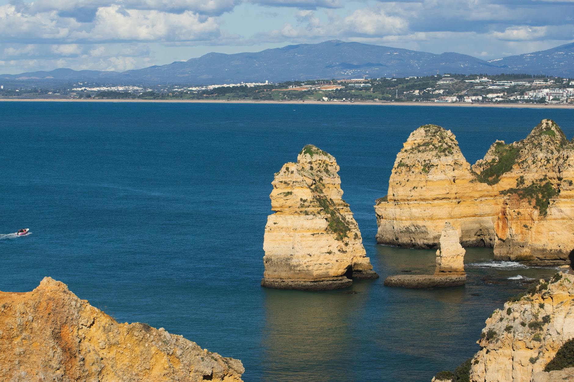 Stunning view of Praia Dona Ana's cliffs in Lagos, Portugal overlooking the Atlantic Ocean.