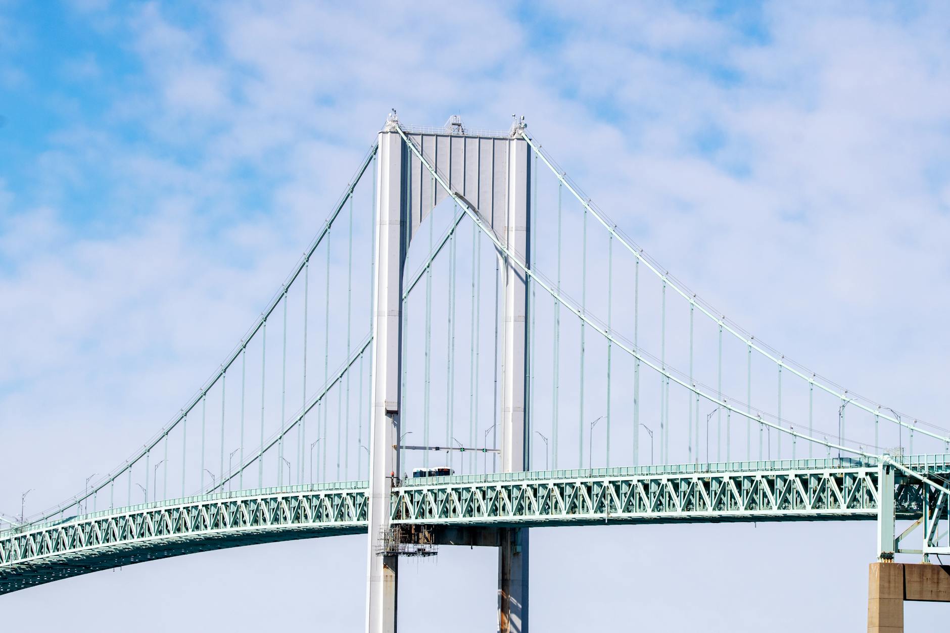 Captivating view of the Newport Pell Bridge against a bright blue sky in Rhode Island.